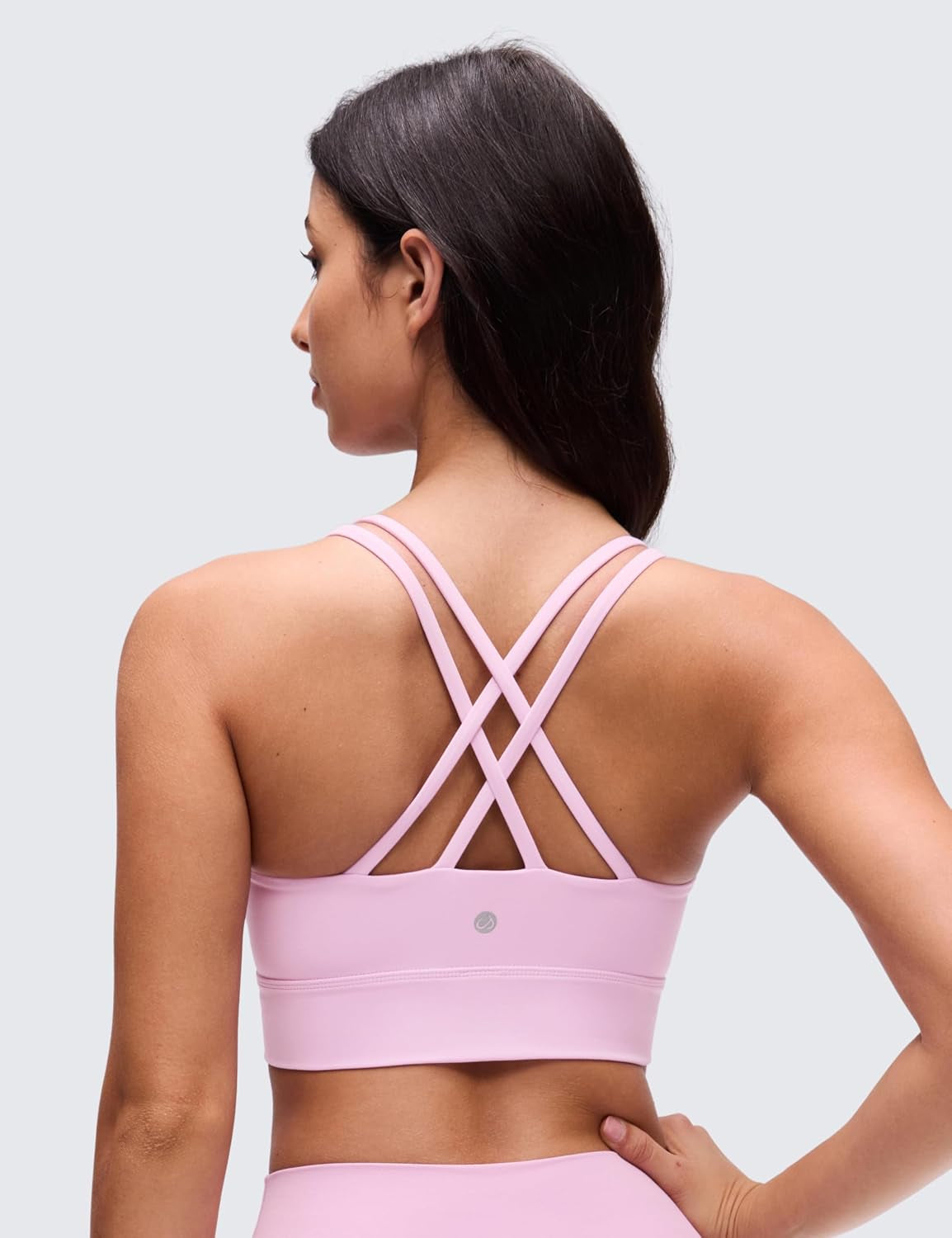 Softness Mold Butterluxe Strappy Longline Sports Brasor Women -Double in pink with crisscross straps shown from the back.